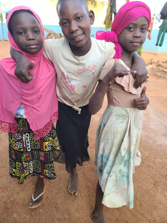 Three girls from New Hope smiling together