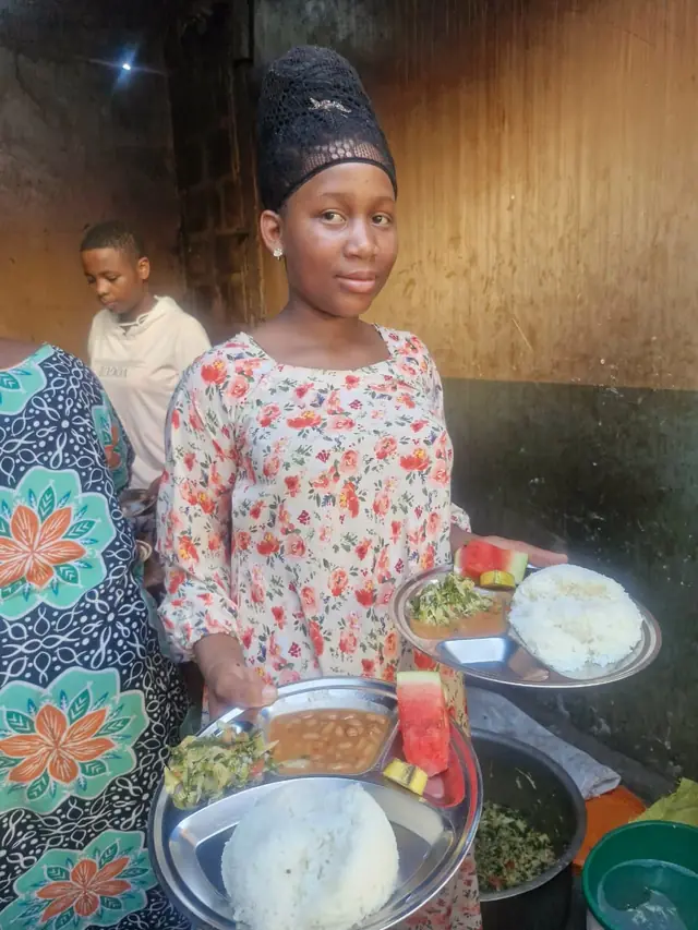 A girl serving lunch