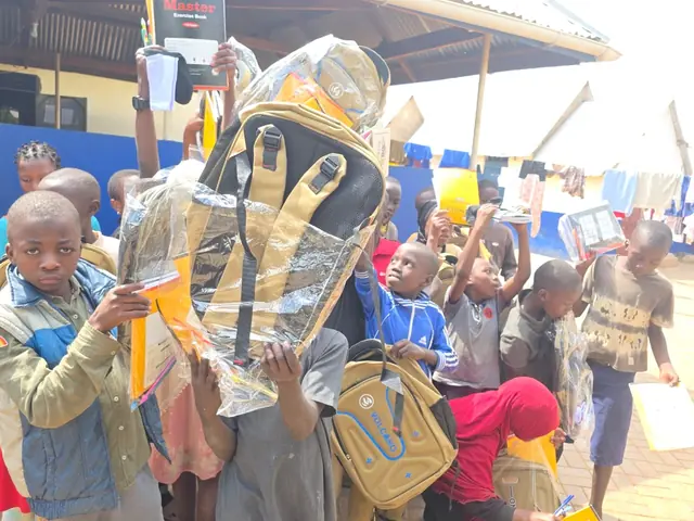Children receiving new backpacks
